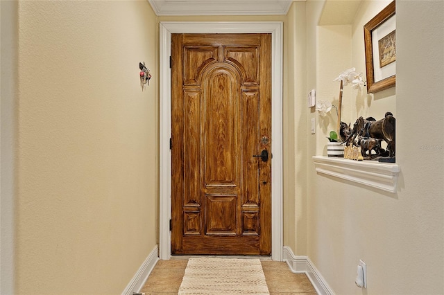 doorway to outside with baseboards