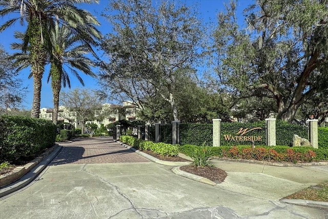 view of property's community featuring fence