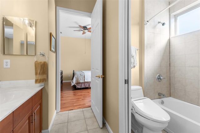 bathroom with vanity, ceiling fan, tile patterned flooring, toilet, and connected bathroom