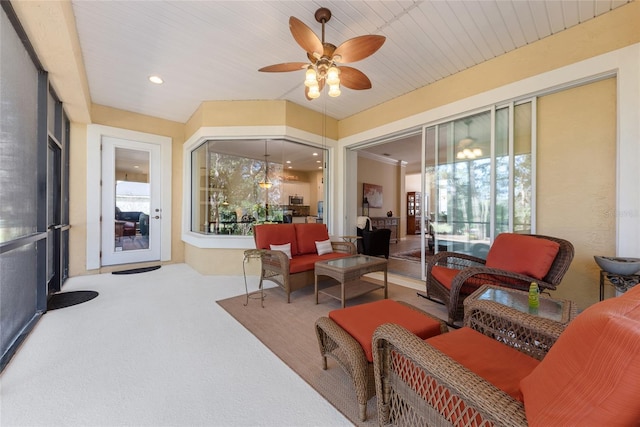 sunroom featuring a healthy amount of sunlight and ceiling fan