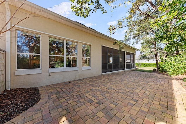 exterior space featuring a sunroom