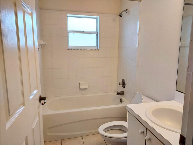 full bath featuring toilet, shower / washtub combination, vanity, and tile patterned flooring