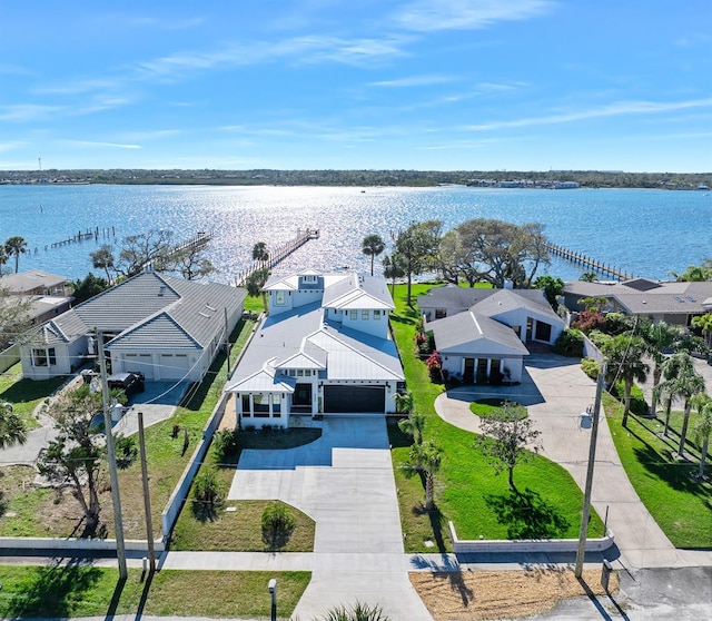 birds eye view of property featuring a residential view and a water view