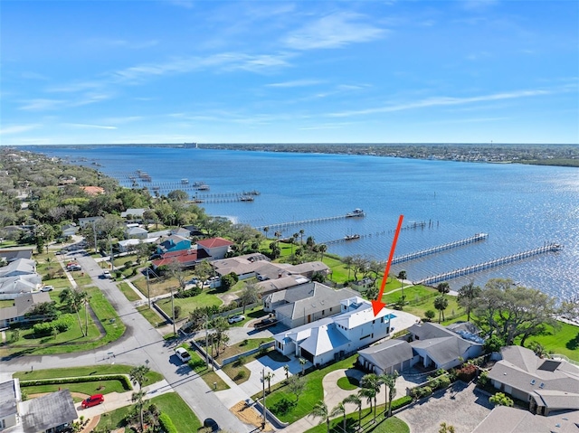 bird's eye view featuring a water view and a residential view