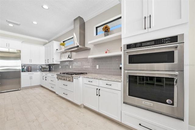 kitchen featuring tasteful backsplash, crown molding, appliances with stainless steel finishes, exhaust hood, and open shelves