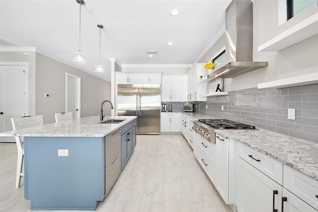 kitchen with open shelves, a sink, stainless steel appliances, crown molding, and wall chimney exhaust hood