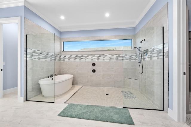 full bath with a freestanding tub, a tile shower, and ornamental molding