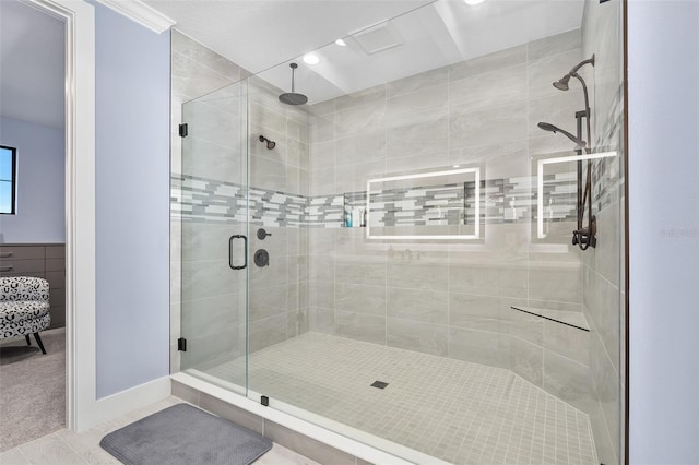 bathroom featuring tile patterned floors and a shower stall