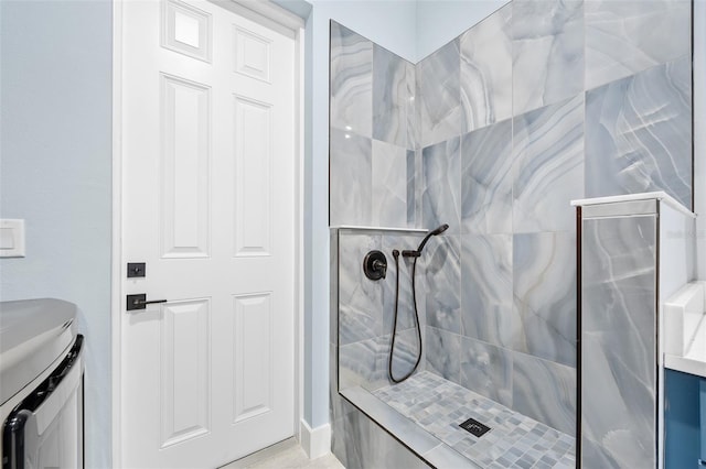 bathroom featuring vanity and a tile shower