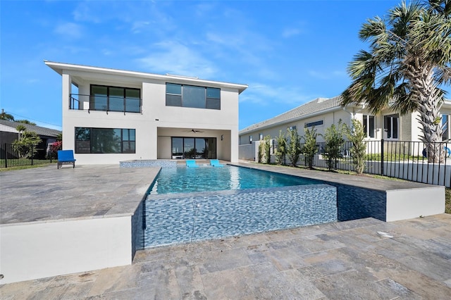 view of swimming pool featuring a patio area, a fenced in pool, and fence