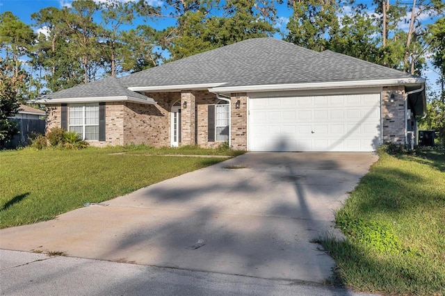 ranch-style home with driveway, roof with shingles, a front lawn, a garage, and brick siding
