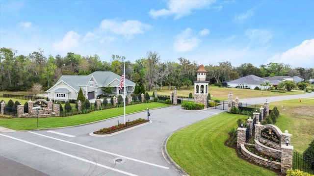 surrounding community with a yard and fence