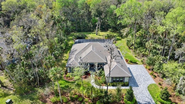 birds eye view of property with a forest view