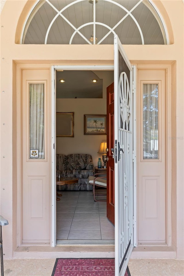 view of exterior entry with stucco siding