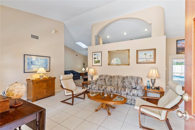 living room featuring visible vents, high vaulted ceiling, and light tile patterned flooring