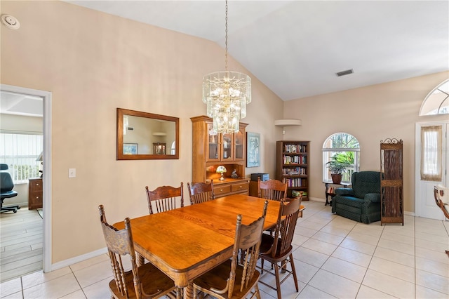 dining room with a notable chandelier, light tile patterned floors, baseboards, and visible vents