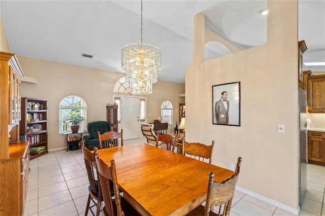 dining room with an inviting chandelier, light tile patterned floors, baseboards, and visible vents