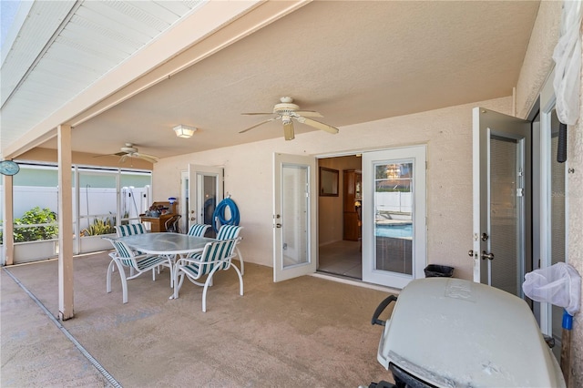 view of patio / terrace featuring outdoor dining space, a ceiling fan, and fence