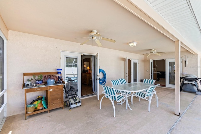 view of patio / terrace with ceiling fan and outdoor dining space