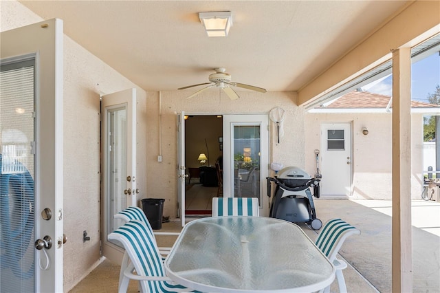 view of patio / terrace featuring outdoor dining area, a ceiling fan, and a grill