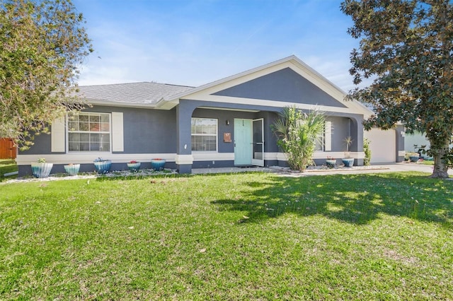 single story home with a shingled roof, a front yard, and stucco siding