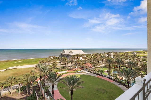 exterior space featuring a water view and a beach view