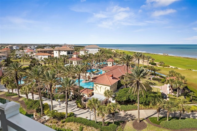 bird's eye view with a water view and a beach view