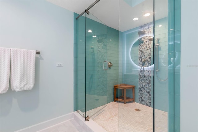 bathroom featuring baseboards and a stall shower