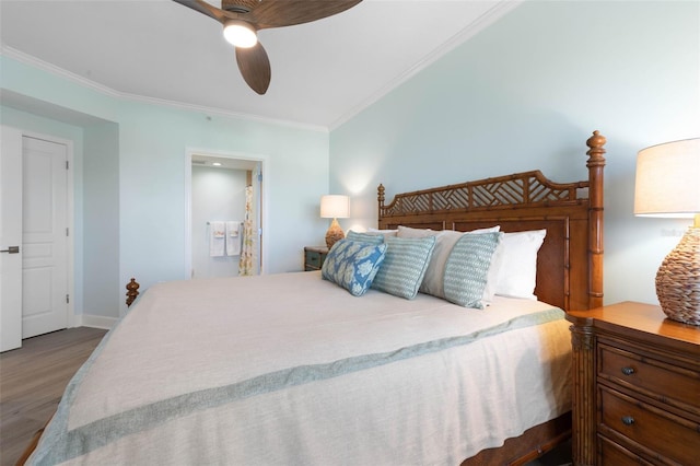 bedroom with a ceiling fan, wood finished floors, connected bathroom, crown molding, and baseboards