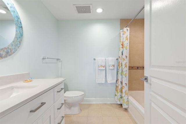 bathroom featuring tile patterned flooring, visible vents, baseboards, toilet, and vanity