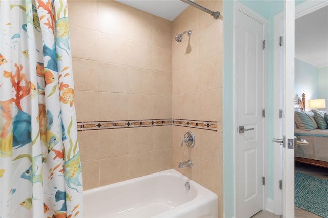 bathroom featuring shower / bath combo, ensuite bathroom, and ornamental molding