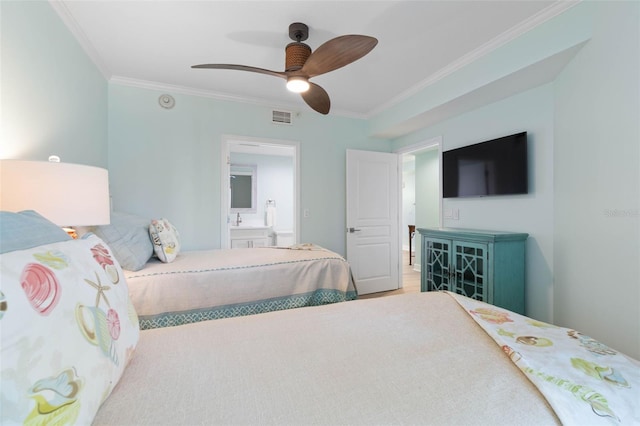 bedroom featuring a ceiling fan, wood finished floors, visible vents, ornamental molding, and ensuite bathroom