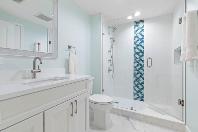 full bathroom featuring vanity, visible vents, a shower stall, toilet, and marble finish floor