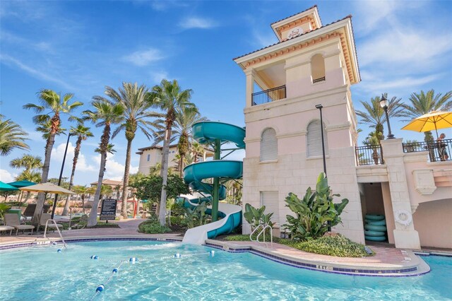 community pool with a water slide