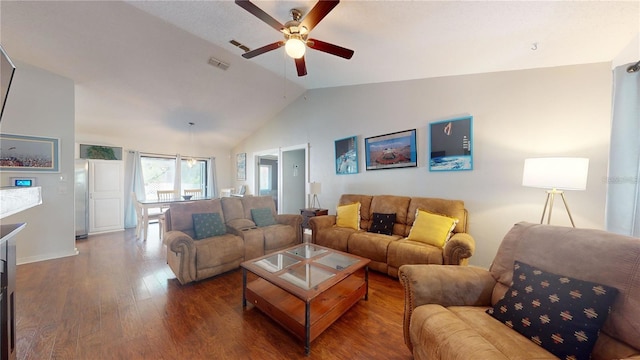 living room featuring lofted ceiling, wood finished floors, visible vents, and ceiling fan