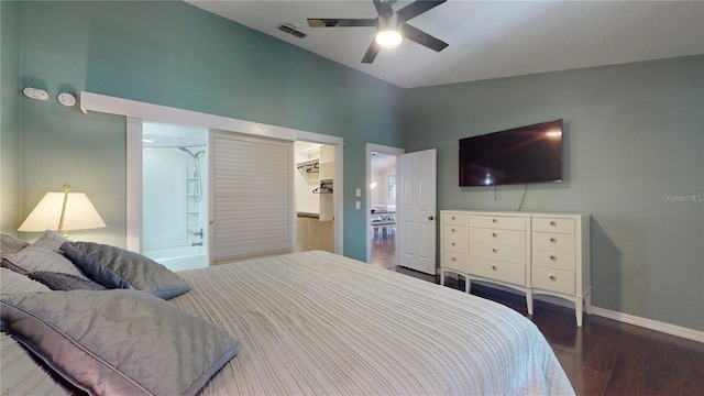 bedroom featuring visible vents, ceiling fan, baseboards, vaulted ceiling, and wood finished floors