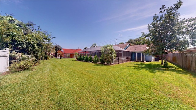 view of yard featuring an outbuilding and a fenced backyard