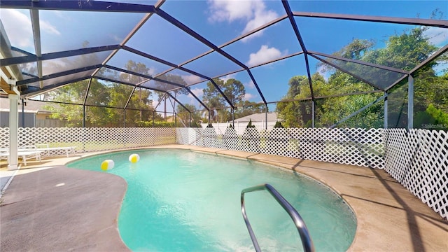 view of pool with a fenced in pool, glass enclosure, and a patio area