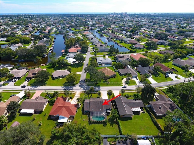 aerial view with a residential view and a water view