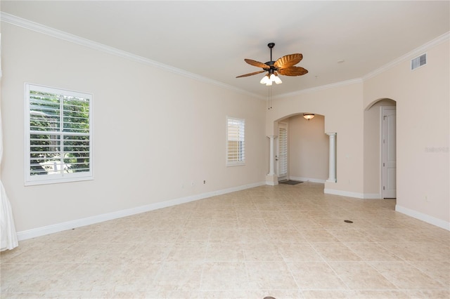 empty room featuring ornamental molding, arched walkways, visible vents, and ceiling fan