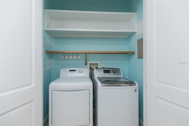 clothes washing area with laundry area and independent washer and dryer