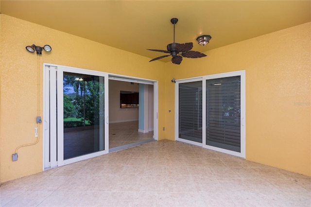 view of patio featuring ceiling fan