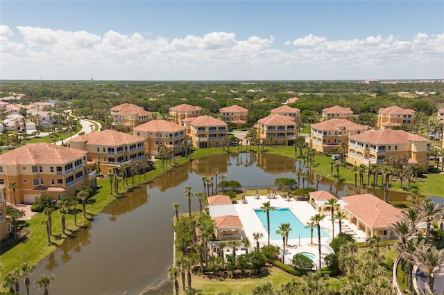 birds eye view of property with a water view