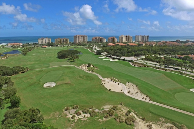 birds eye view of property featuring a view of city, golf course view, and a water view