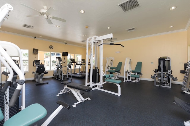 workout area featuring a ceiling fan, baseboards, visible vents, and ornamental molding