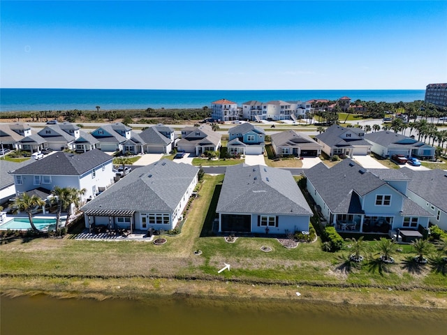 aerial view with a residential view and a water view