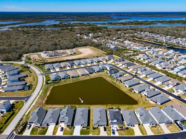 birds eye view of property with a residential view and a water view