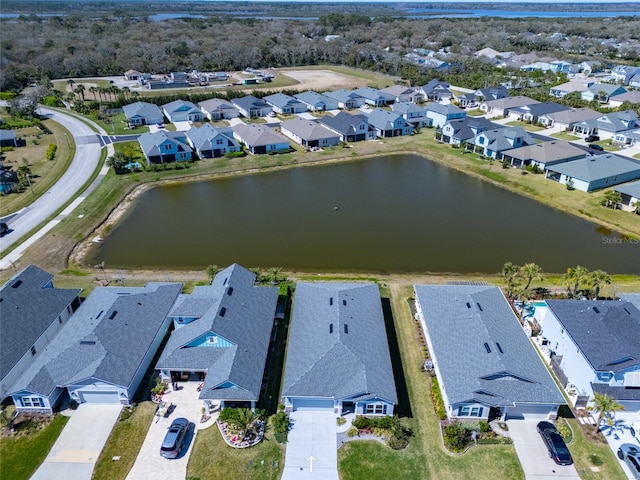 birds eye view of property featuring a residential view and a water view