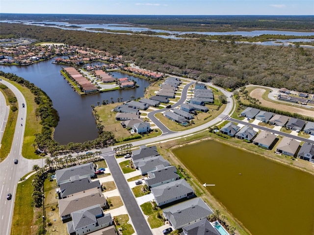 birds eye view of property featuring a residential view and a water view