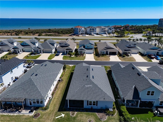 aerial view with a residential view and a water view